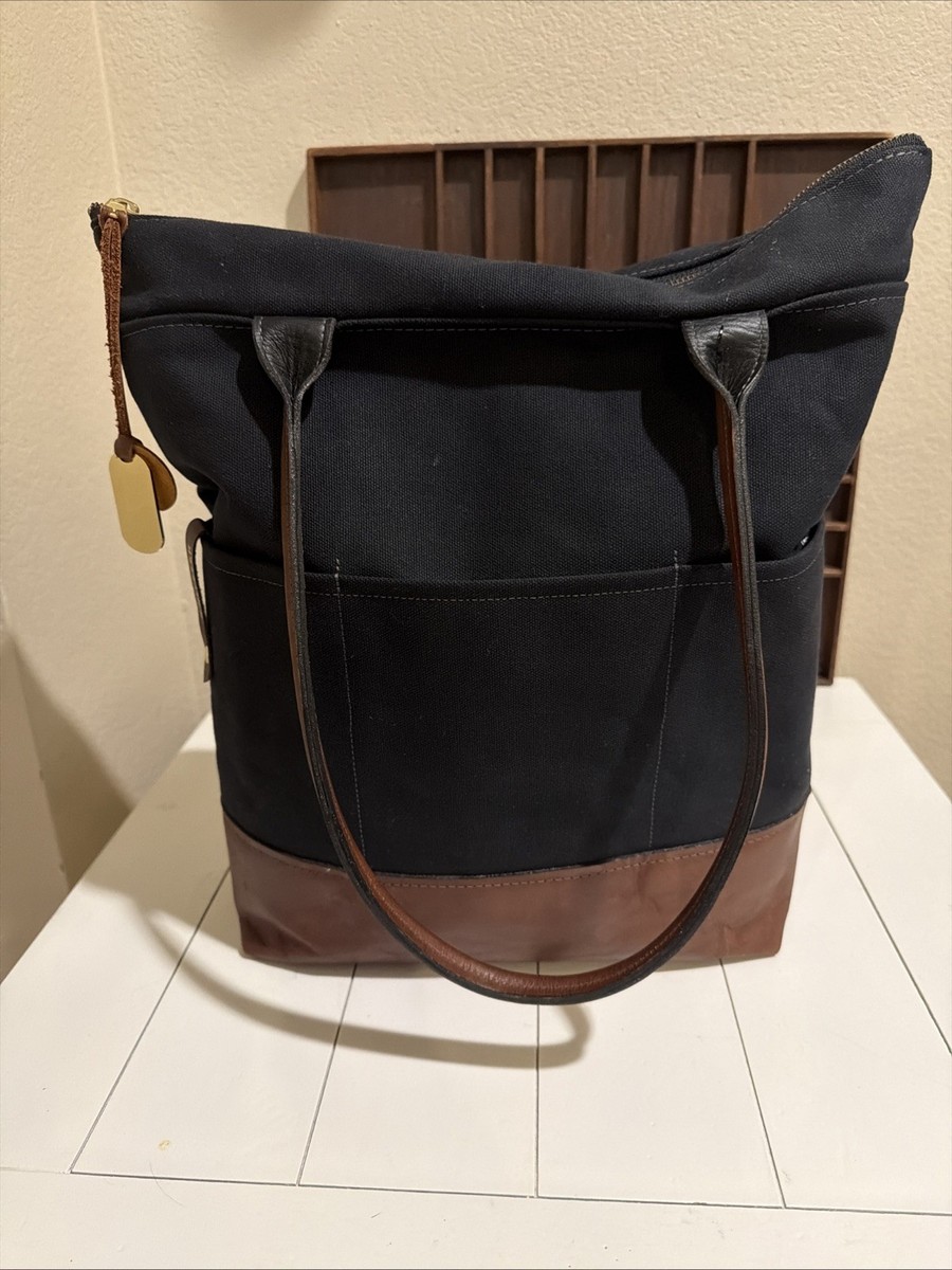 R. Riveter Baker Black Canvas & Brown Leather Tote Bag INTRODUCING THE BAKER. ⁠ ⁠ Work, play or travel you can  main image 4