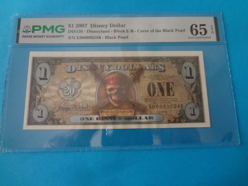 2007 "E-B Block Series" Black Pearl $1 Disney Dollar - PMG 65 Gem Unc. s/n E0000