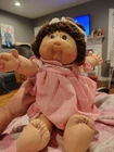 CABBAGE PATCH KIDS  BRN PIGTAILS BROWN EYES BOXED PINK OUTFIT