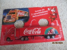 Coca-Cola-Weihnachts-Track-Werbemodell-Weihnachtsmann mit Kind