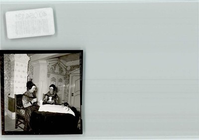 40064131 - 2251 Pellworm women in costumes eat an ice cream costume Germany