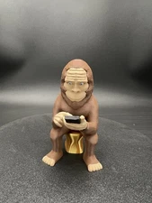 Sasquatch Bigfoot Figurine Scrolling And On A Golden Throne!