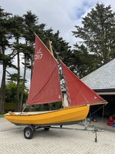 Cornish Coble Sailing Boat. Excellent Condition. Bright yellow With Tan Sails