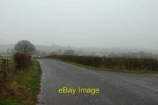 Photo 6x4 Wintery showers on Swindon Lane Kirkby Overblow Looking along S c2021