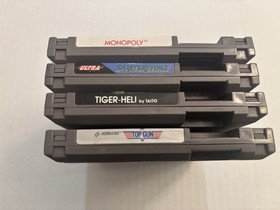Lotto 4 giochi Nintendo NES - Snake's Revenge, Top Gun, Monopoly, Tiger-Heli