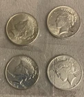 1924-P PEACE DOLLARS [[lot of four]] (xf-au)