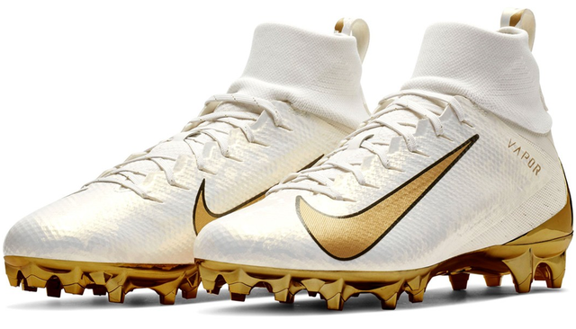 white and gold nike football cleats