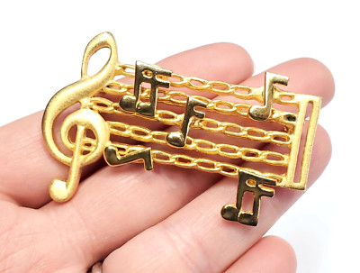 Vintage Musical Brushed Gold Tone Music Bar Articulated Notes Treble Brooch Pin