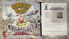 GREEN DAY SIGNED DOOKIE VINYL BILLIE JOE, TRE COOL AND MIKE DIRNT - BECKETT LOA