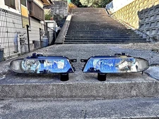 Genuine Nissan Skyline R33 Late Model Headlights w/ Aftermarket HID L&R