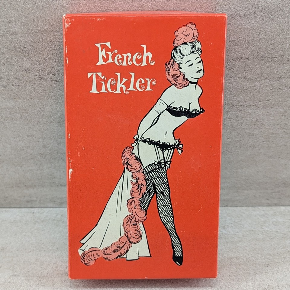 A vintage rubber middle-finger gag toy with its original box — the OG rude gesture novelty before the emoji existed.