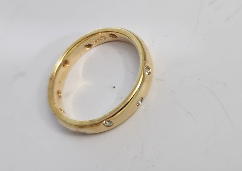 14KT DIAMOND ETERNITY STYLE BAND S-7. WT 3.8 GR