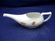ANTIQUE PORCELAIN INVALID FEEDER WITH A BEAUTIFUL FLORAL DECORATION.
