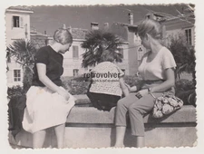 Two Women and a Little Girl Gaze at Fountain Their Backs Turned to the Camera