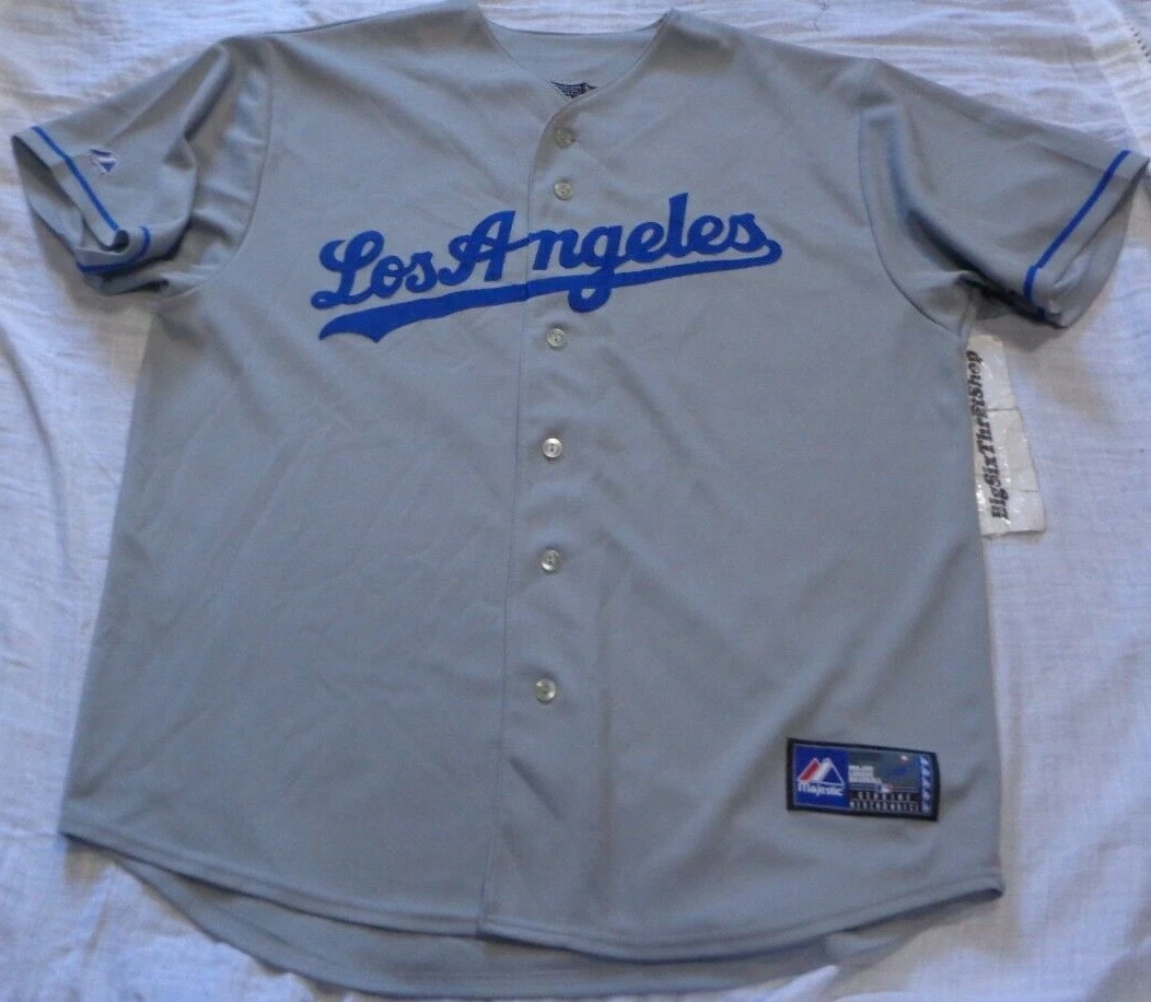 A fan holds up a jersey for Los Angeles Dodgers' Manny Ramirez