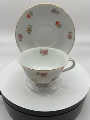 A Noritake porcelain teacup and saucer with pink roses and gold trim