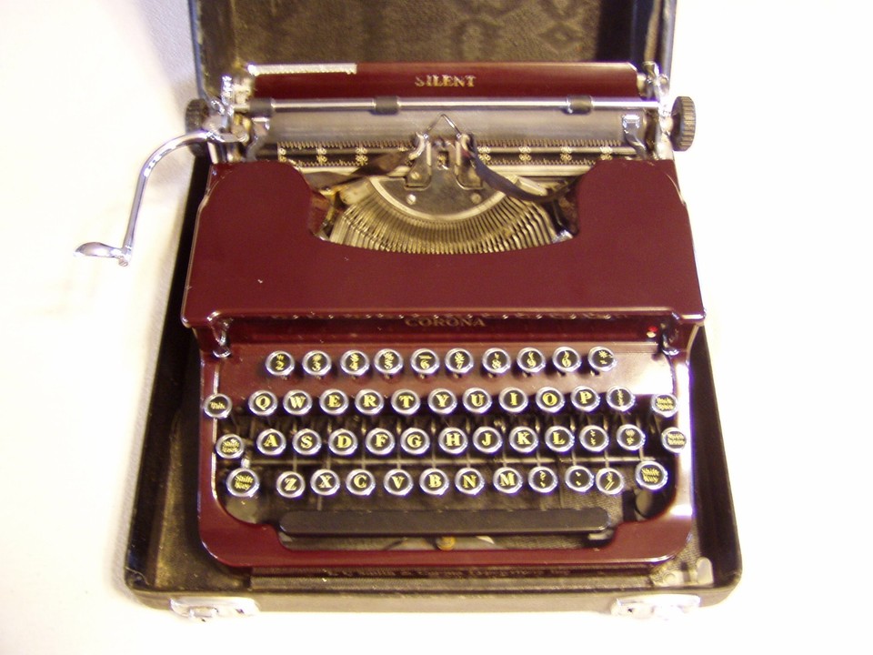 Art Deco maroon-red LC Smith & Corona Silent in working order — that color alone makes it a stunning objet d'art, not just a typewriter.