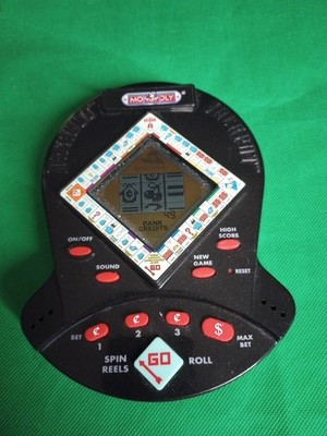 Monopoly Hasbro 1999 handheld electronic game  WMS gaming