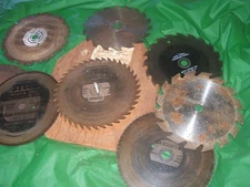 Vintage lot of 9 circular saw blades 7 inch used Kept Mounted on Board  w Handle