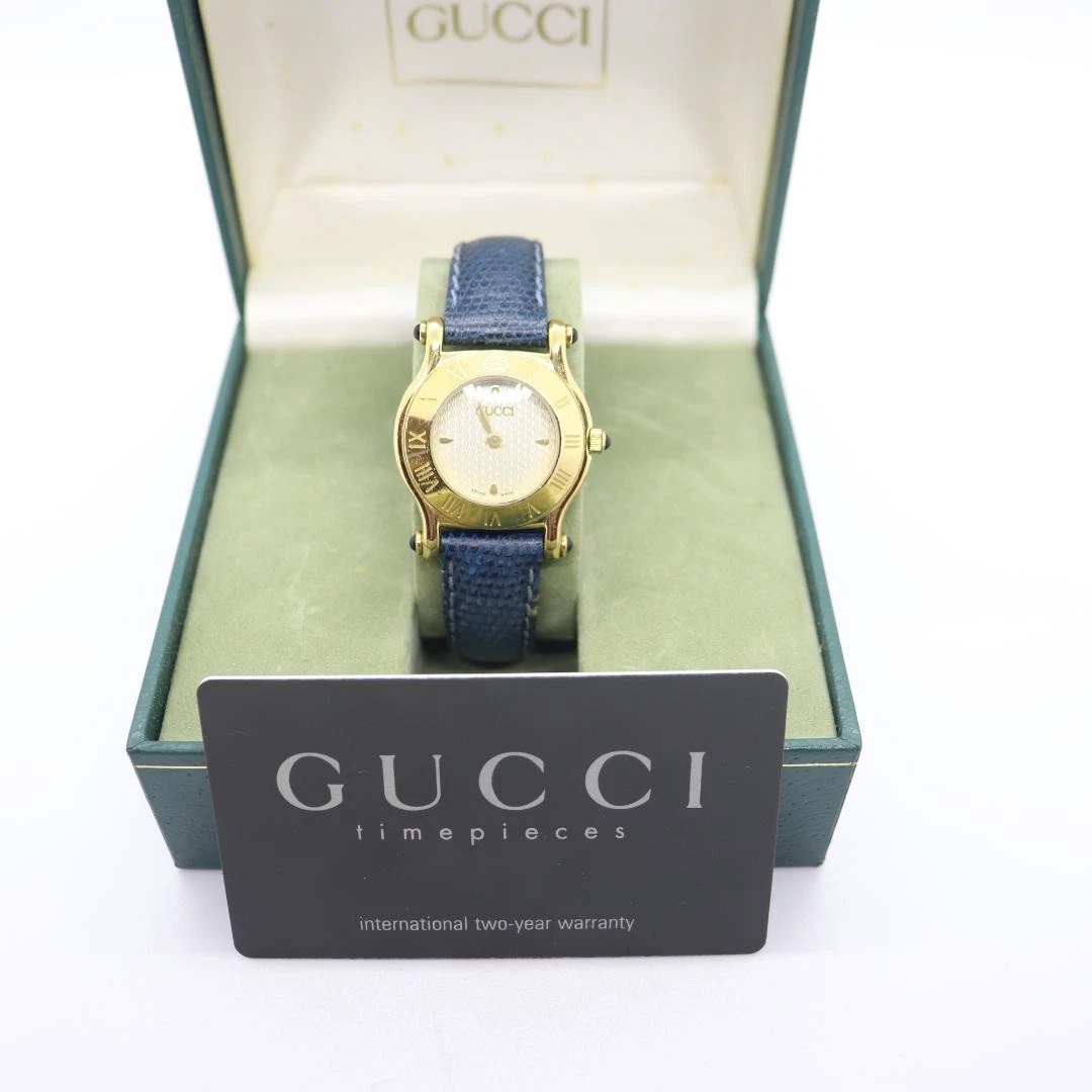 Montre Gucci 6500L blanche femme 27 mm quartz ronde vintage boîte
