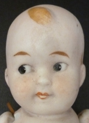 Antike deutsche Puppe vom Typ Kewpie aus Biskuitporzellan. 4'' / 10cm