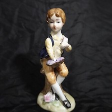 Vintage Porcelain Boy Holding Rose Basket Sitting on Tree Stump Statue Figurine