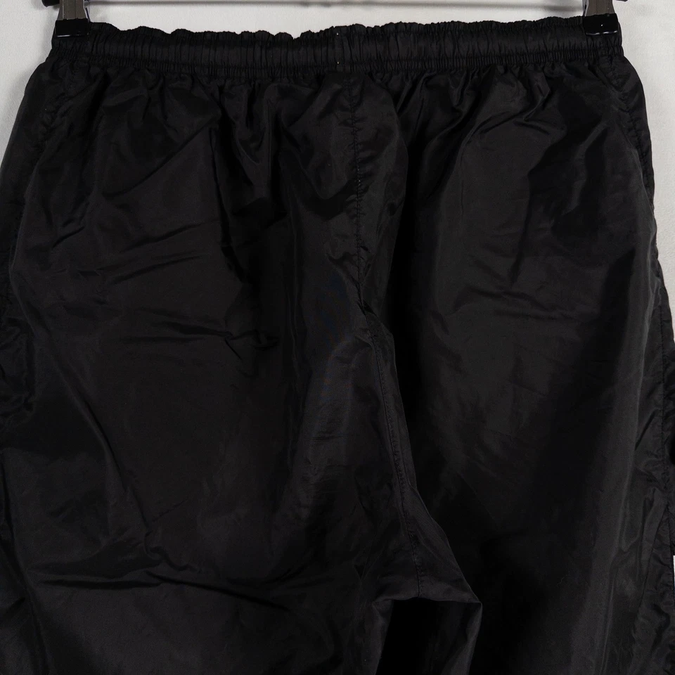 Pantalones de chándal Nike para hombre grandes negros blancos de nailon estilo vintage años 90 puños con cremallera Y2K Foto 4 de 4