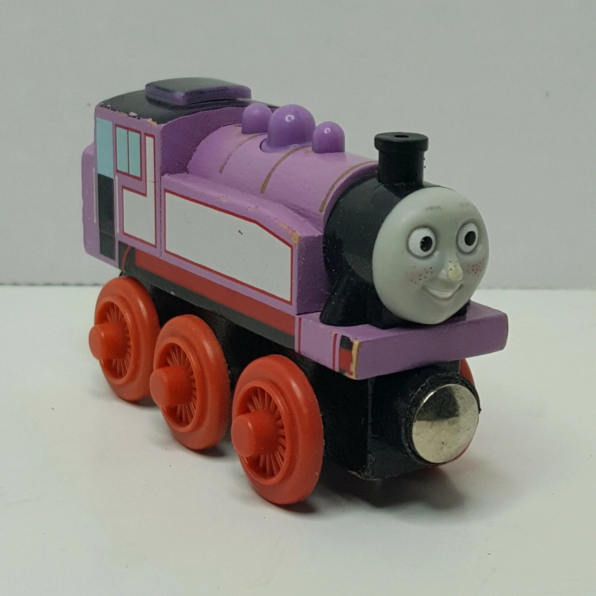 Rosie the pink Thomas the train on a wooden railroad Stock Photo