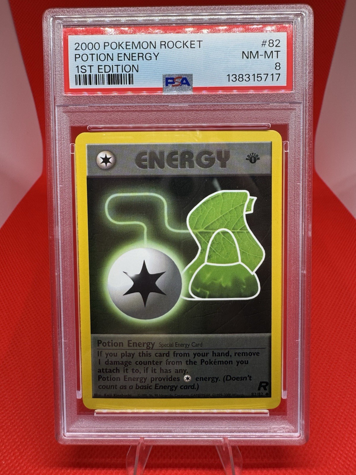 2000 Pokemon Team Rocket 1st Edition Potion Energy #82 PSA NM-MT 8 Vintage