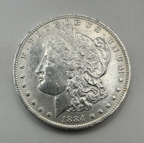 Morgan Dollar - 1884O - Strong Breast feathers, Nice EF/AU