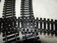 Un lot de 7 rails courbes Lima pour trains électriques miniatures au H0 HO