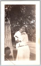 Vtg B&W Snapshot Woman In Striped Dress Holding Baby By Tree 1951