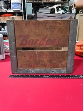 vintage Borden's Dairy wooden milk crate featuring red lettering and embossed...
