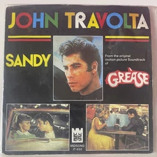 John Travolta – Sandy / Rainbows Midsong International JT-650 • Holland • 1978