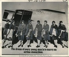 1975 Press Photo Female attendants as poster models to boost sales - noc80390