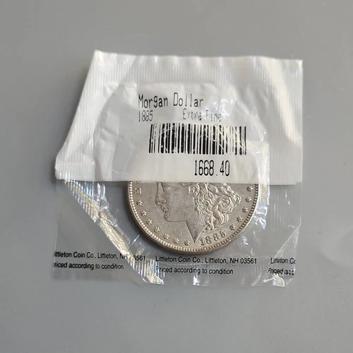 1885 $1 Morgan Silver Dollar in a Littleton Packet - extra fine
