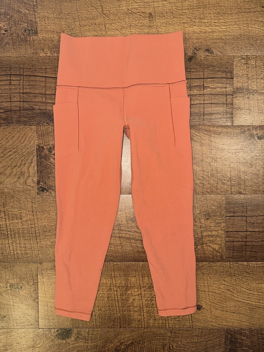 ATHLETA - ginger ATHLETA GINGER ORANGE SALUTATION STASH POCKET TIGHTS! XXSP