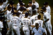 Kirk Gibson Los Angeles Dodgers is mobbed by teammates after - Baseball Photo 1