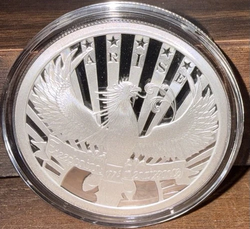 ￼Phoenix Rising 1  OZ  99.9 % Pure Silver Silver Bullet Silver Shield