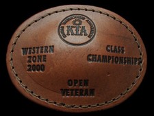 KH17143 2000  KANSAS TRAPSHOOTERS ASSOCIATION  CHAMPIONSHIP LEATHER BUCKLE