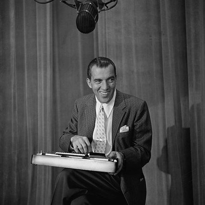 American TV host Ed Sullivan plays a xylophone on the set of his w- Old Photo