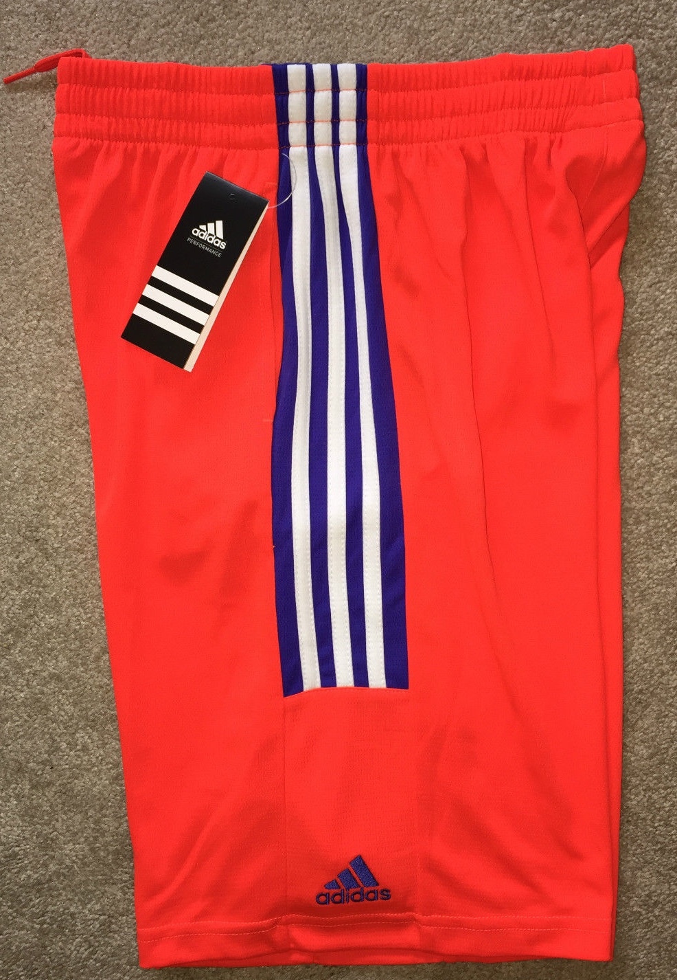 white adidas shorts with red stripes