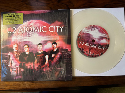 U2 - ATOMIC CITY - UK - 7'' SINGLE - LTD ED PHOTOLUMINESCENT VINYL - 2023