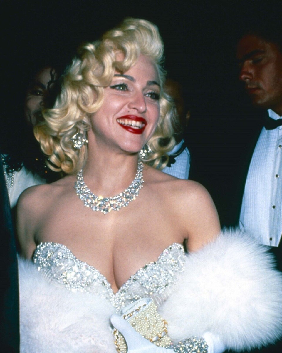 Madonna 1990's smiling in low cut silver gown & diamond necklace