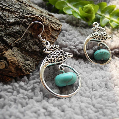 Boucles d'oreilles Tibétaines en Argent Tibétain et Turquoise reconstituée - Photo 1/4