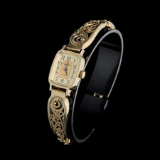 Small women's cocktail watch with gold color. Vintage women's mechanical watch.