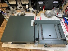 Icom 751A top and bottom covers, with feet, carry handle, and wire bail stand.