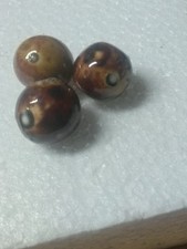 three BENNNINGTON CLAY MARBLES