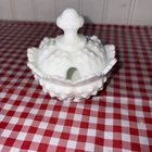 This is a Fenton hobnail milk glass sugar bowl with a lid.