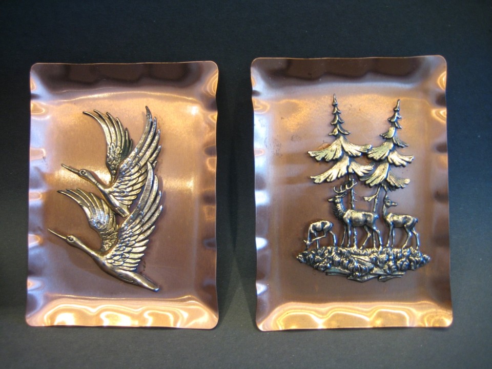 Tiny 3D copper wall art plaques from Germany with intricate deer, trees, and birds — the kind of mid-century European craft object you can't just order new.